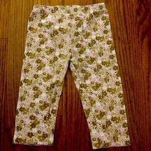 Brown and light purple pants with a money but